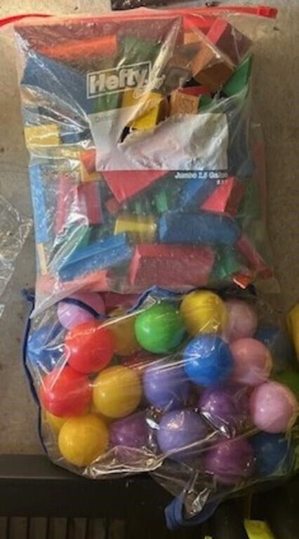Bag of Assorted Colorful Building Blocks and Plastic Ball Pit Balls